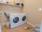 Laundry Room with washer and dryer and detergent.